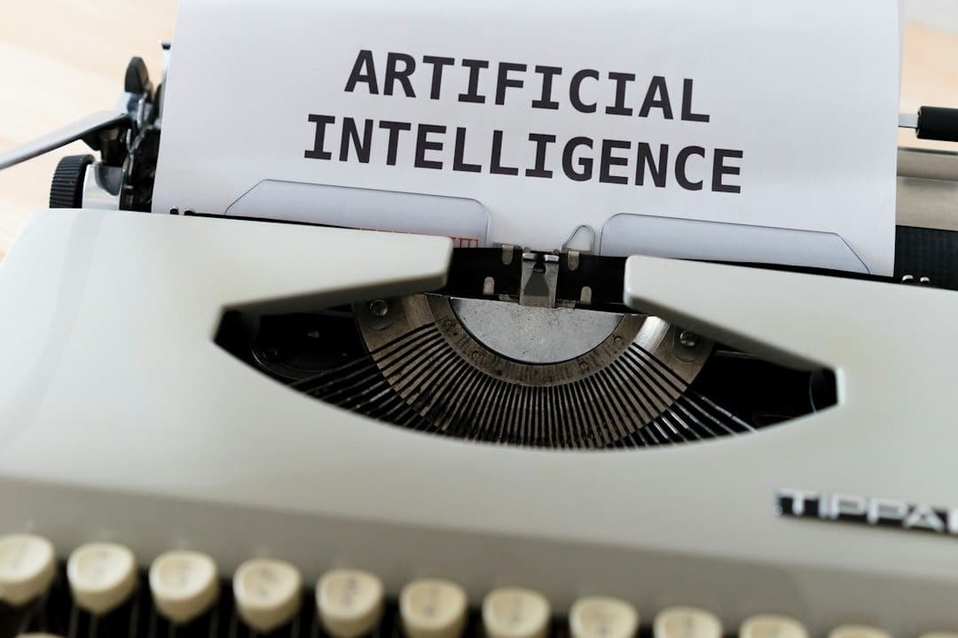 Vintage typewriter with a sheet reading the phrase 'ARTIFICIAL INTELLIGENCE'.